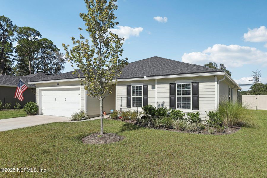 Front exterior of a new home in Creekside Manor, Jacksonville, FL, highlighting curb appeal (Image 2). Front exterior of a new home in Creekside Manor, Jacksonville, FL, highlighting curb appeal (Image 2).