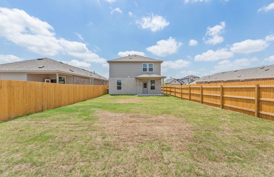 Exterior details and patio area of a home in Crosswinds, Kyle (Image 17).