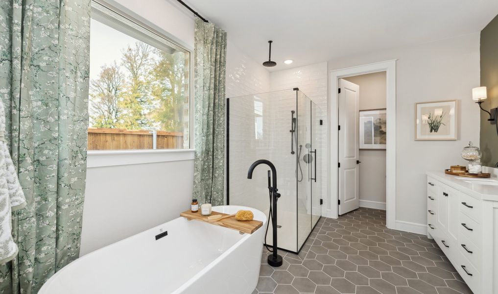 Primary bath with hexagonal flooring Primary bath with hexagonal flooring