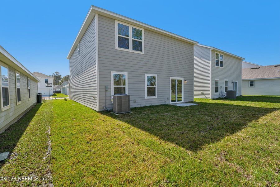Exterior details and patio area of a home in Kings Landing, Jacksonville (Image 28).