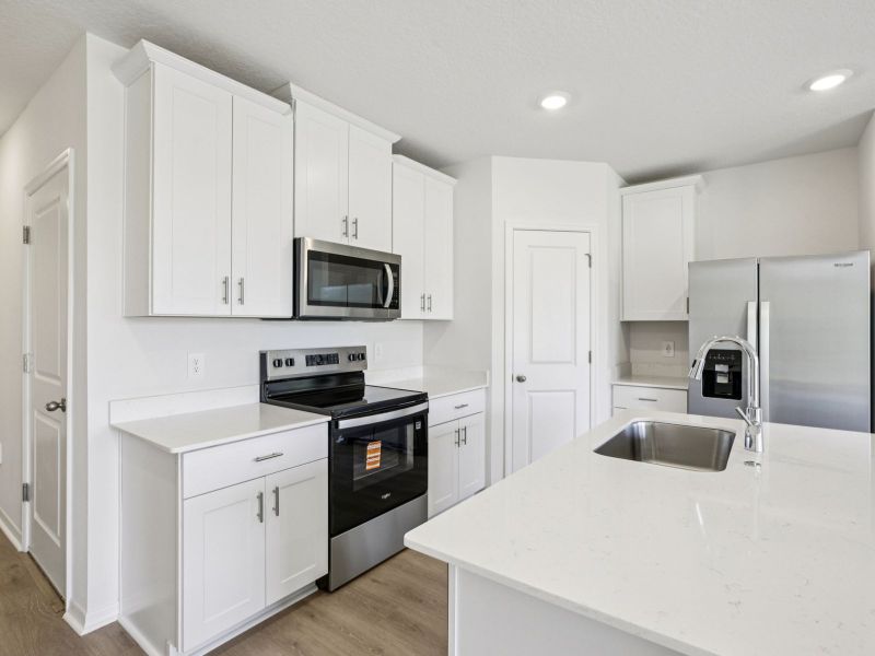 Furnished interior view inside a new home in The Reserve at Hammock Oaks Townes, Lady Lake (Image 4).