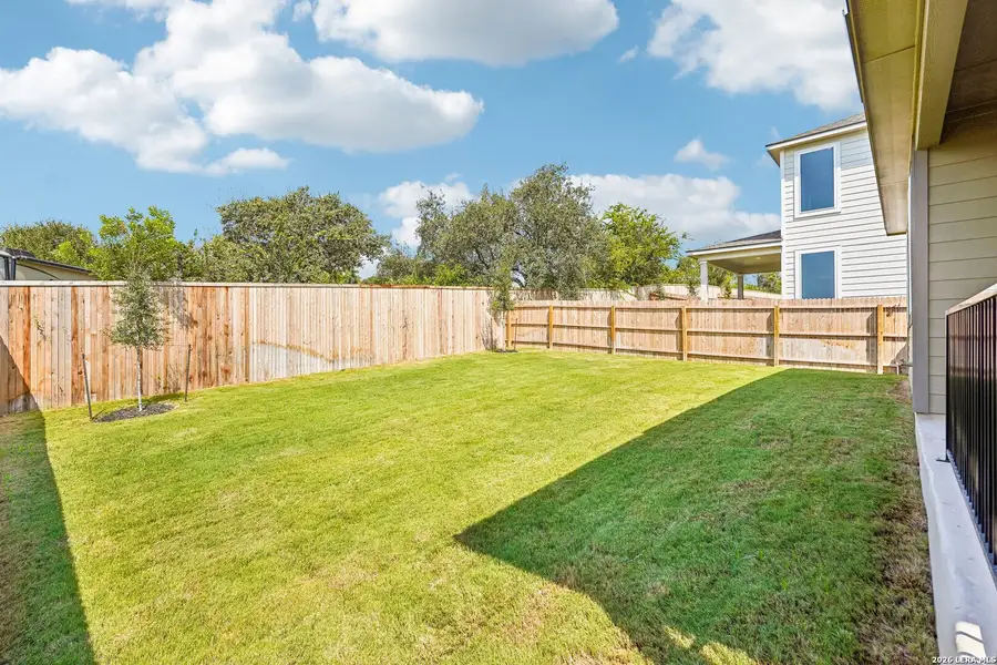 Exterior details and patio area of a home in Weston Oaks, San Antonio (Image 23).