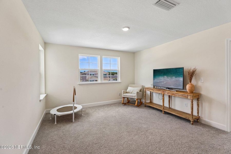 Furnished interior view inside a new home in Seasons at Morada, St. Augustine (Image 33).