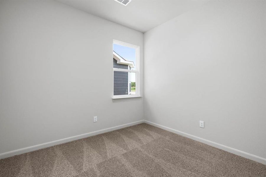 Spare room with carpet and baseboards Spare room with carpet and baseboards