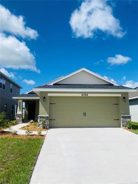 Front exterior of a new home in , St. Cloud, FL, highlighting curb appeal (Image 16).