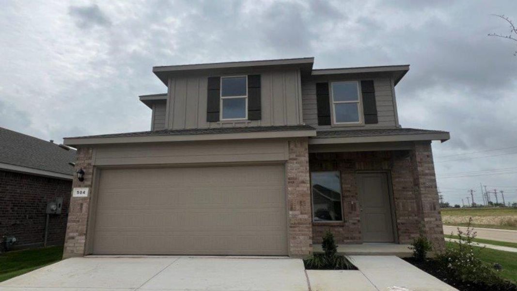 Front exterior of a new home in Monarch at the Meadows, Ponder, TX, highlighting curb appeal (Image 1). Front exterior of a new home in Monarch at the Meadows, Ponder, TX, highlighting curb appeal (Image 1).