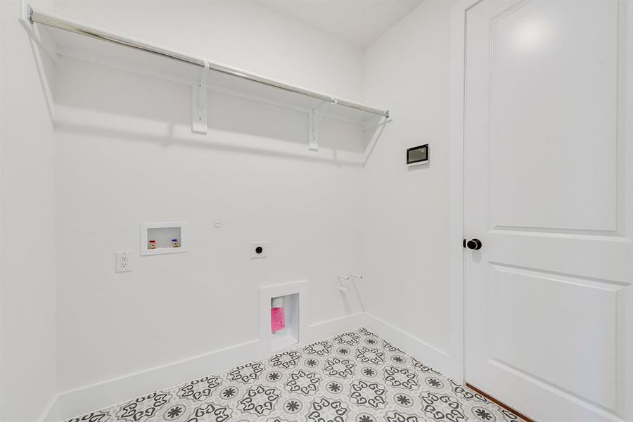 Laundry room with washer hookup, electric dryer hookup, and gas dryer hookup Laundry room with washer hookup, electric dryer hookup, and gas dryer hookup