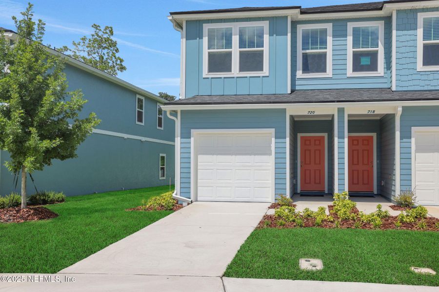 Front exterior of a new home in Kasen Oaks, Jacksonville, FL, highlighting curb appeal (Image 17).