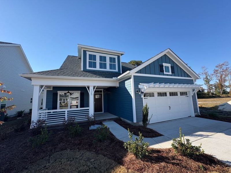 Front exterior of a new home in Riverside Cove, Wilmington, NC, highlighting curb appeal (Image 24).