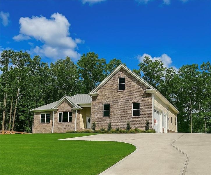 Front exterior of a new home in , Canton, GA, highlighting curb appeal (Image 1).