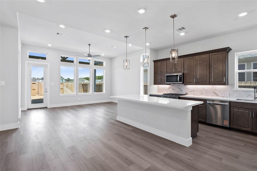 Step into a bright, expansive open-concept living space designed for modern life and seamless entertaining. Step into a bright, expansive open-concept living space designed for modern life and seamless entertaining.