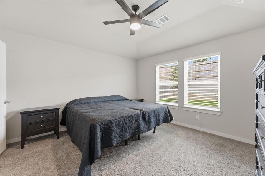 Primary Bedroom easily fits a king size bed with room for your favorite pieces of furniture or decor. All bedrooms have ceiling fans with remotes Primary Bedroom easily fits a king size bed with room for your favorite pieces of furniture or decor. All bedrooms have ceiling fans with remotes