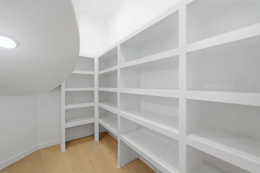 Custom built-in shelving providing extensive storage