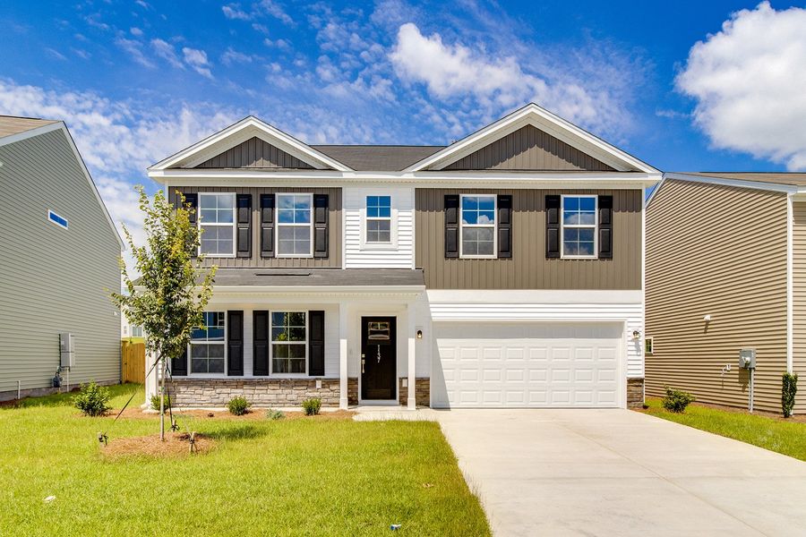 Front exterior of a new home in Ellington, Elgin, SC, highlighting curb appeal (Image 1). Front exterior of a new home in Ellington, Elgin, SC, highlighting curb appeal (Image 1).