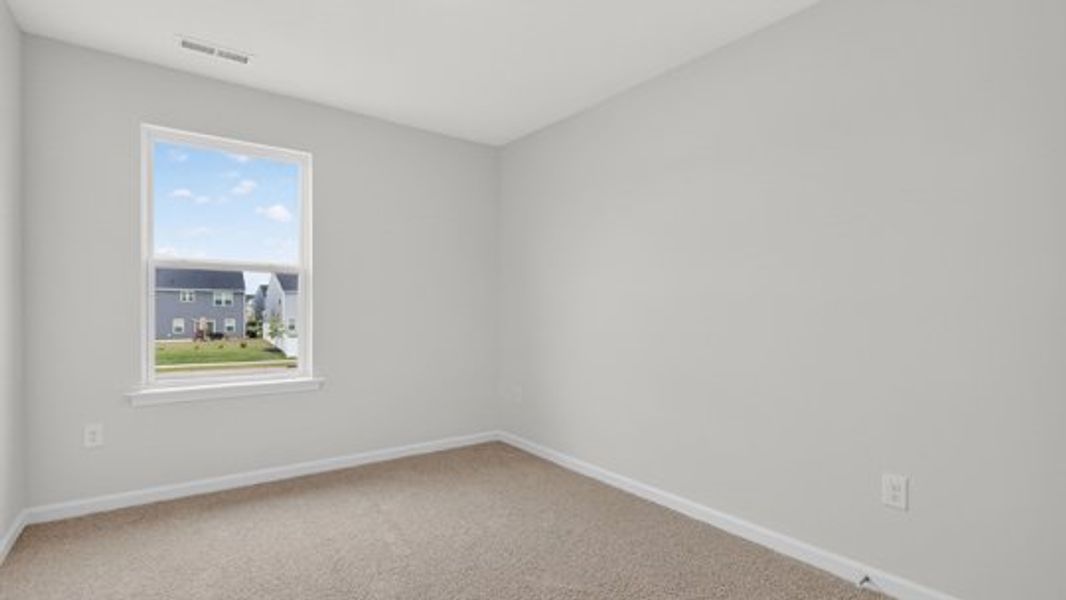 Spacious, unfurnished interior of a new home in The Townes at Belle Grove, Wendell (Image 15).