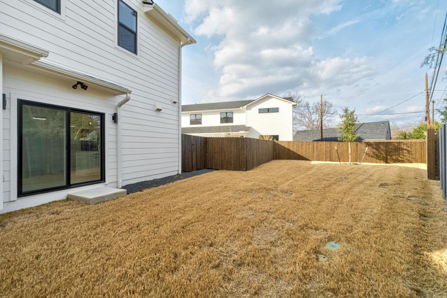 View of fenced backyard