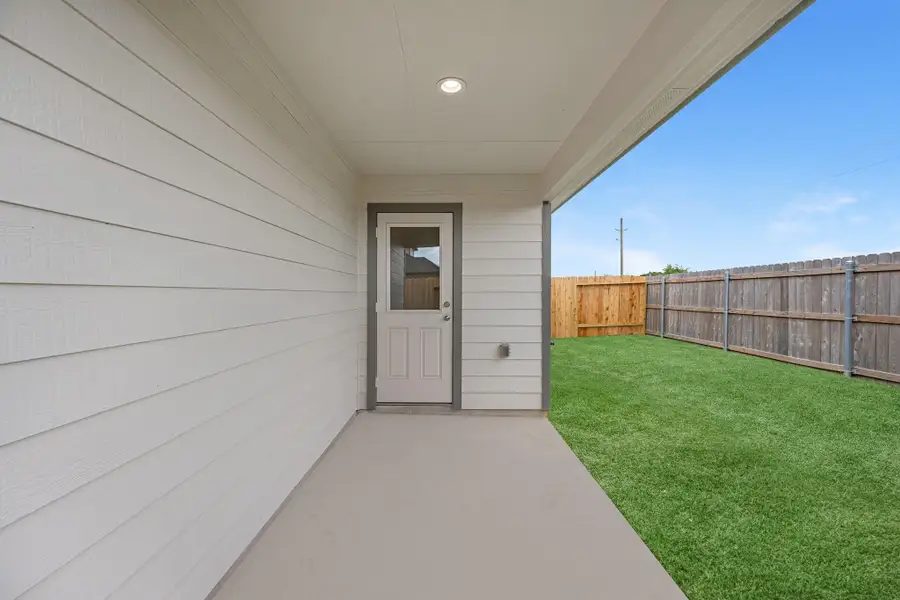 Exterior details and patio area of a home in Grand Oaks Village, Houston (Image 4).