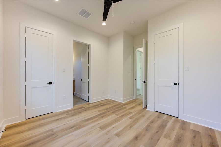 Guest Bathroom 2. All bathrooms feature American Standard toilets, Delta champagne bronze fixtures, 3cm quartz, contemporary cabinetry, and designer tile selections.