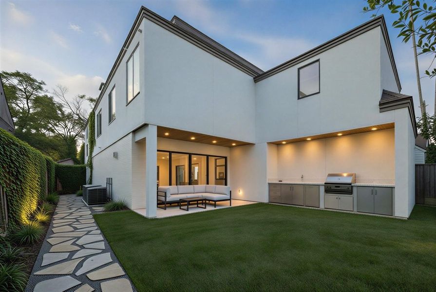 Rendering: Backyard at dusk with summer kitchen and patio.