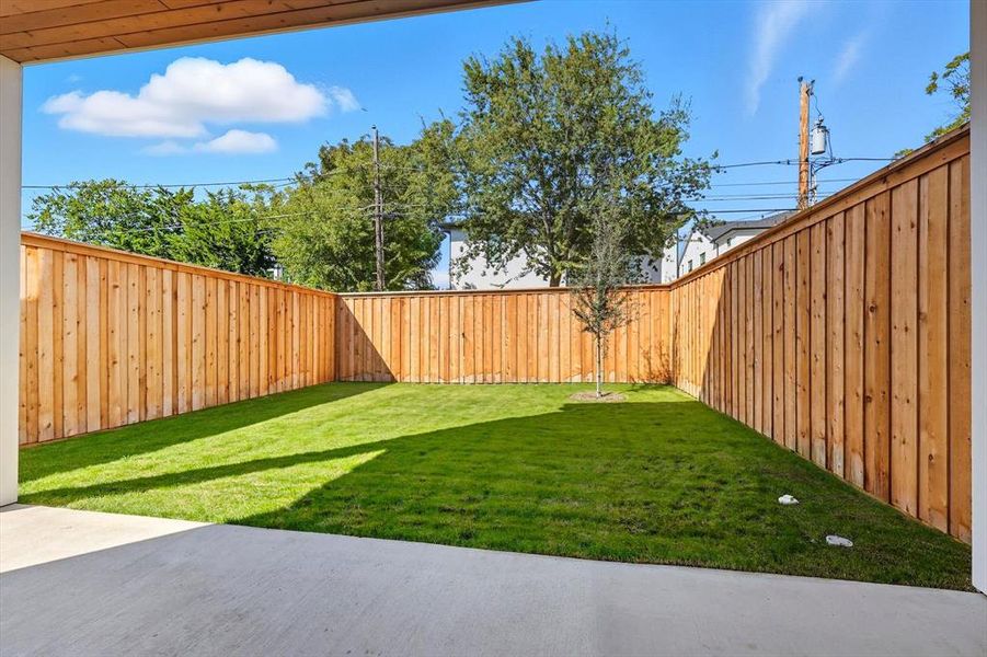 Fenced backyard with a patio Fenced backyard with a patio