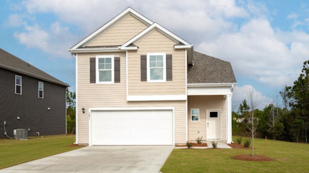 Front exterior of a new home in Saltgrass Landing, Winnabow, NC, highlighting curb appeal (Image 1). Front exterior of a new home in Saltgrass Landing, Winnabow, NC, highlighting curb appeal (Image 1).
