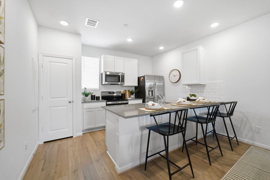 Representative furnished interior of a home built from the Pei by CastleRock Communities in Municipal Drive Townhomes, Leander (Image 12). Representative furnished interior of a home built from the Pei by CastleRock Communities in Municipal Drive Townhomes, Leander (Image 12).
