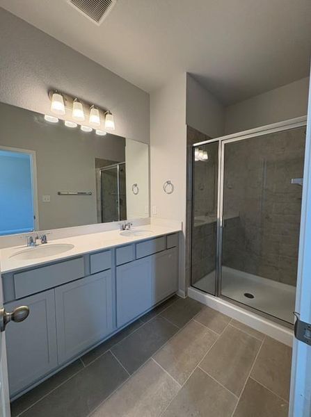 Dual Vanities and walk-in shower in Primary Bath