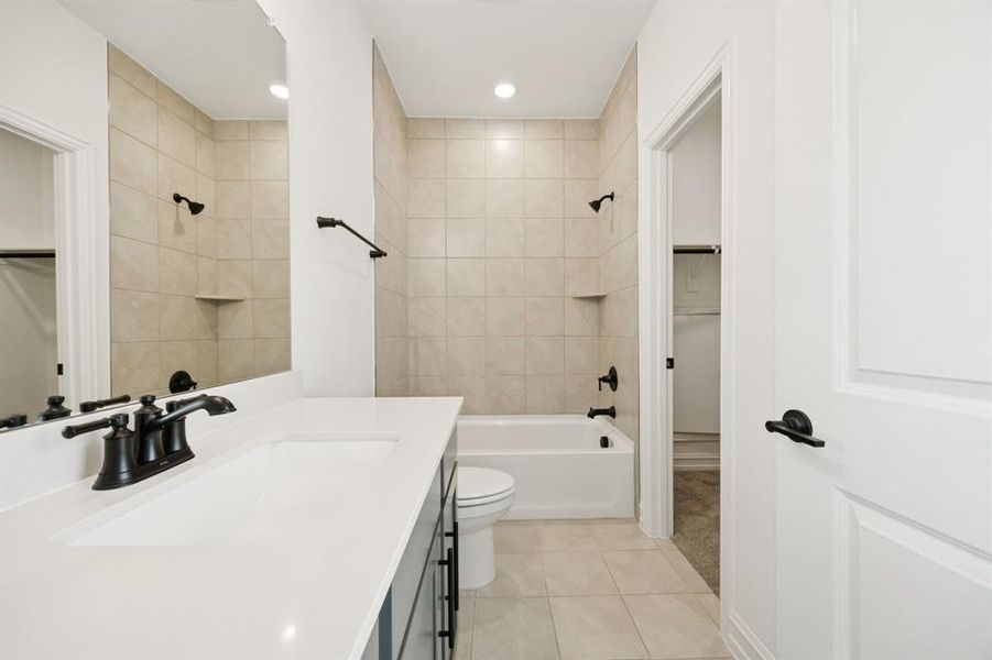 Spacious secondary bathroom. *Model representation.