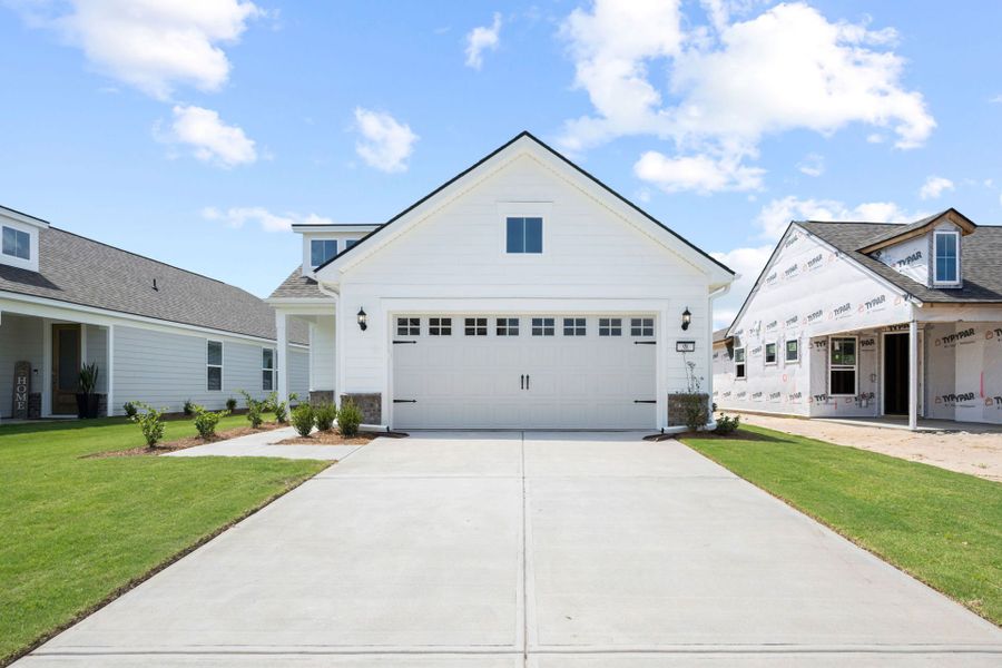 Front exterior of a new home in Del Webb Savannah at Heartwood, Richmond Hill, GA, highlighting curb appeal (Image 2). Front exterior of a new home in Del Webb Savannah at Heartwood, Richmond Hill, GA, highlighting curb appeal (Image 2).