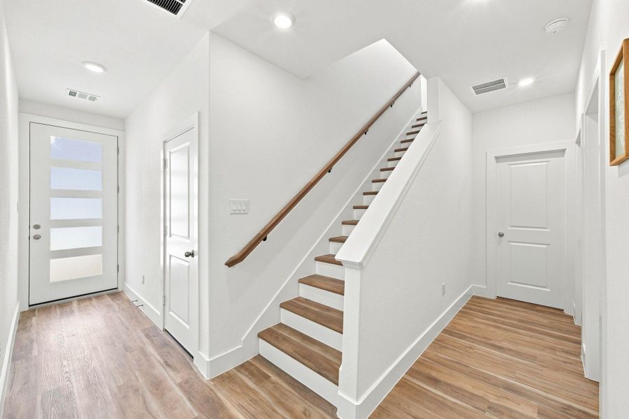 Beautiful wood staircase with an open design connecting the home's living spaces. Beautiful wood staircase with an open design connecting the home's living spaces.