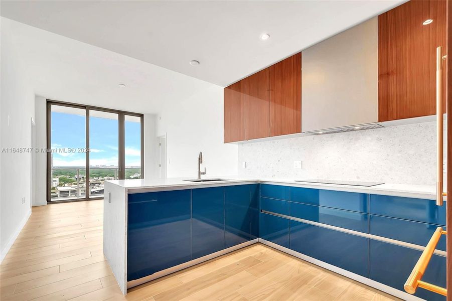 OPEN KITCHEN TO LIVING AREA AND BALCONY