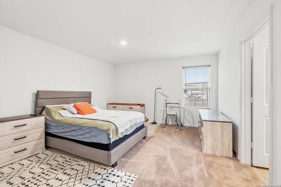 Furnished interior view inside a new home in Tarasco Gardens, San Antonio (Image 10).