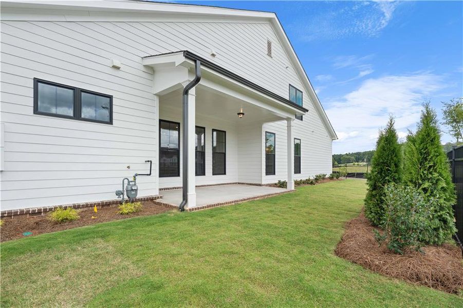 Front exterior of a new home in Promenade at Sawnee Village, Cumming, GA, highlighting curb appeal (Image 23).