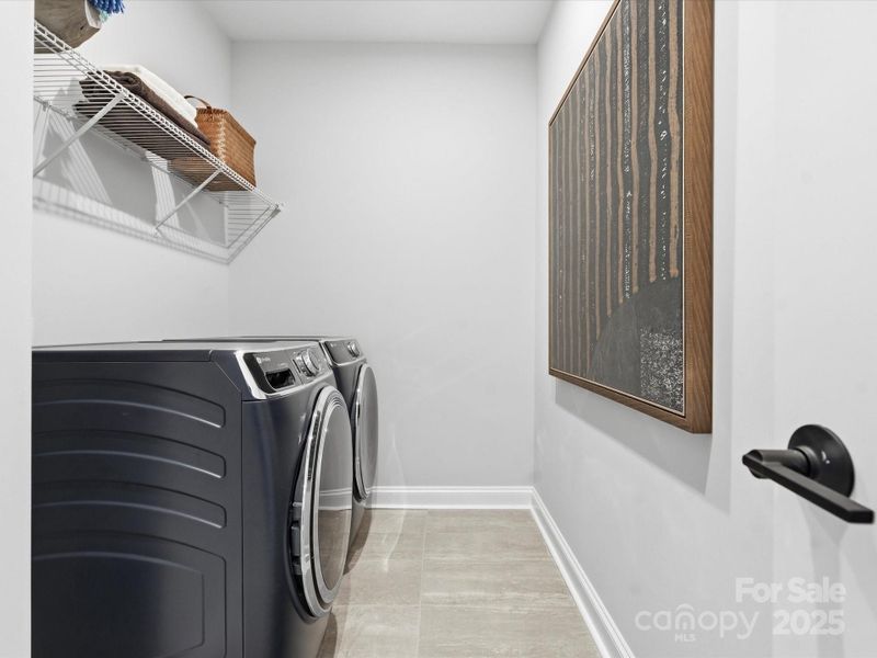 Laundry Room with Modern Tile Design. *Model Photos | Actual Finishes, Structural Selections, and Orientation May Vary.