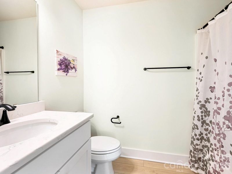 Third full bathroom, on upper level.