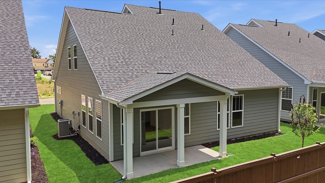 Highly functional rear covered porch adds memorable living space to this elegant home Highly functional rear covered porch adds memorable living space to this elegant home