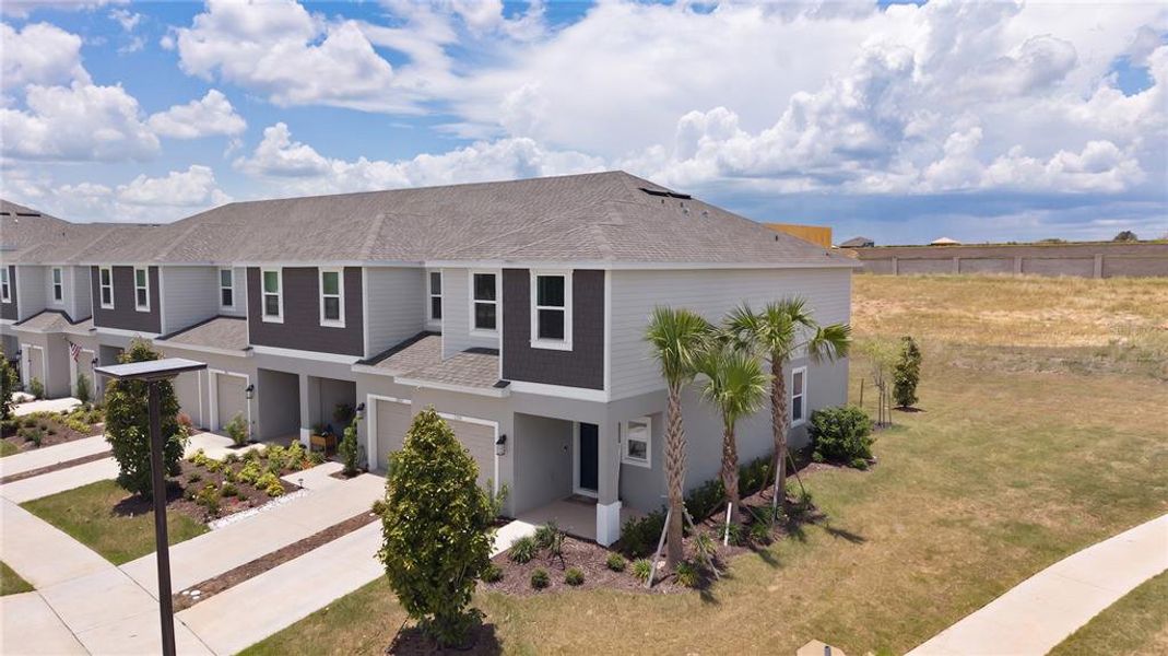 Front exterior of a new home in Waterstone, Groveland, FL, highlighting curb appeal (Image 26).