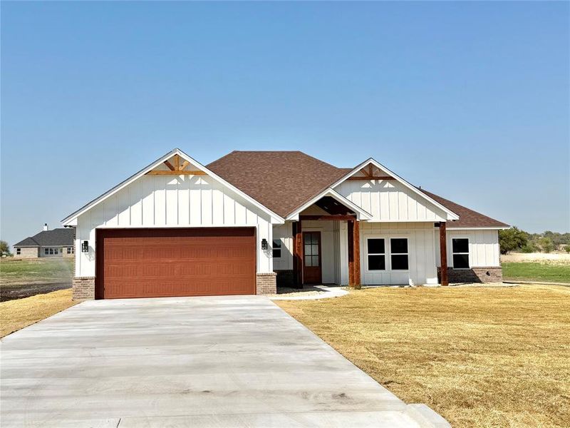 Front exterior of a new home in , Weatherford, TX, highlighting curb appeal (Image 25).