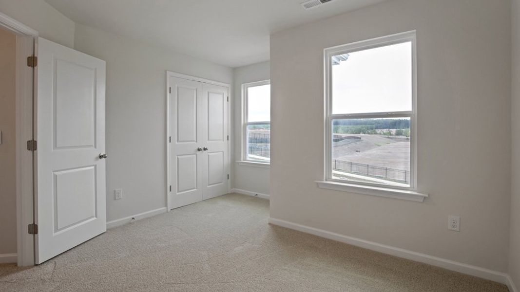Spacious, unfurnished interior of a new home in The Grove at Matthews Landing, Fuquay Varina (Image 21).