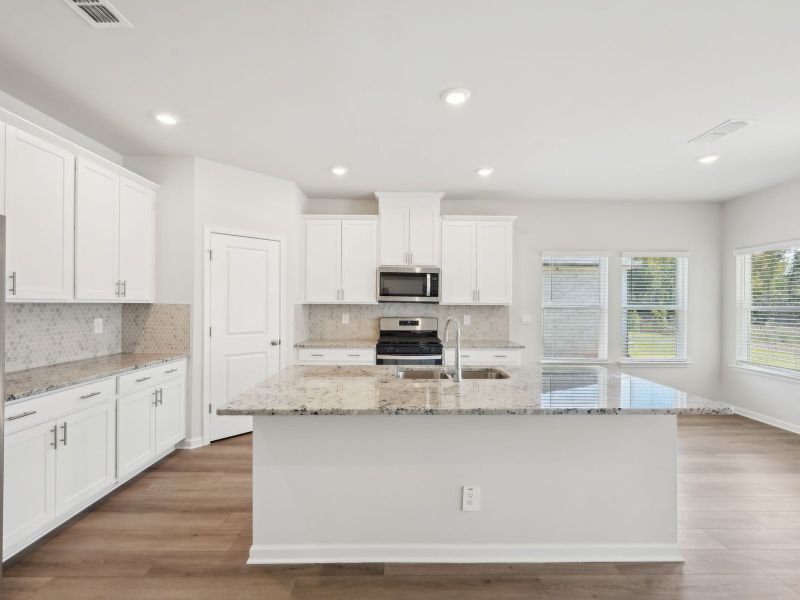 Furnished interior view inside a new home in Martin Springs - Estate Series, Lawrenceville (Image 6).