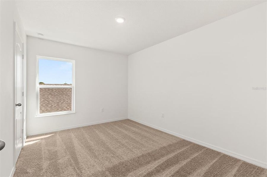 Spacious, unfurnished interior of a new home in Peach Crossings, Winter Haven (Image 21).