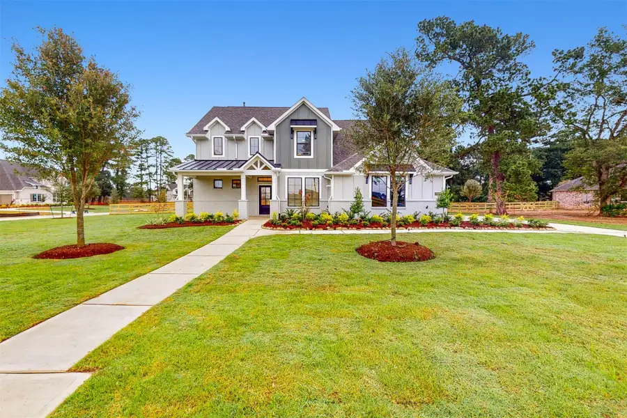 Front exterior of a new home in Sorella, Tomball, TX, highlighting curb appeal (Image 2).
