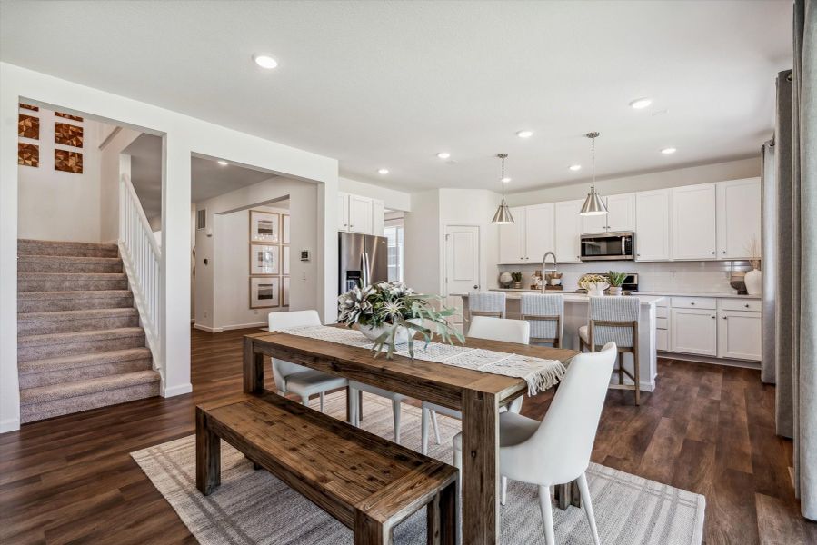 A kitchen with a dining table. A kitchen with a dining table.