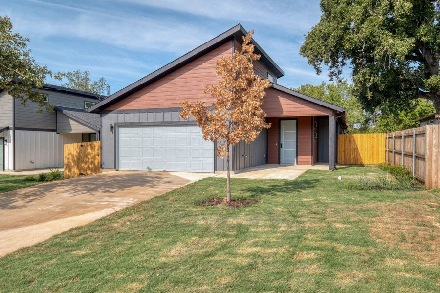 View of front of property featuring driveway, board and batten siding, and a garage View of front of property featuring driveway, board and batten siding, and a garage