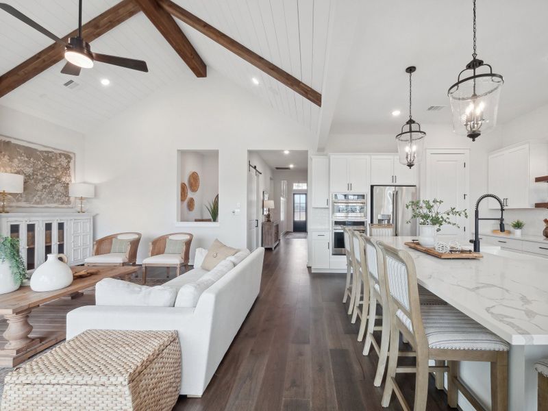 Kitchen with vaulted ceiling and pendant lighting