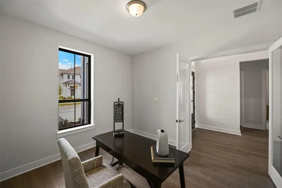 Furnished interior view inside a new home in Bridgeland 70′, Cypress (Image 5).