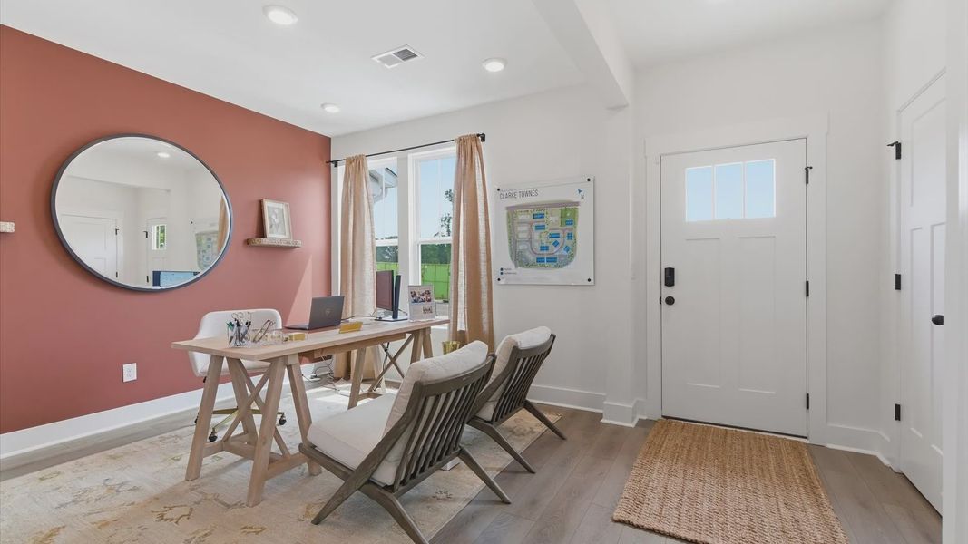Accomplished hardwood flooring foyer sets the tone for tasteful design throughout the home at the Churchill Design