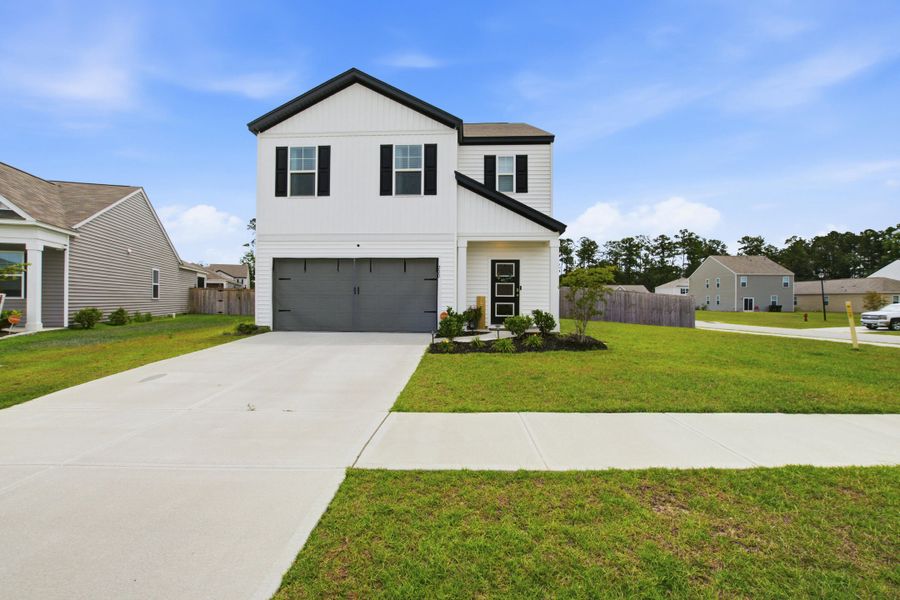 Front exterior of a new home in , Summerville, SC, highlighting curb appeal (Image 2). Front exterior of a new home in , Summerville, SC, highlighting curb appeal (Image 2).