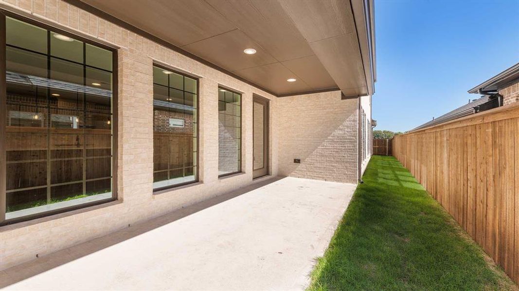 Exterior details and patio area of a home in The Parks At Wilson Creek 40', Celina (Image 2).