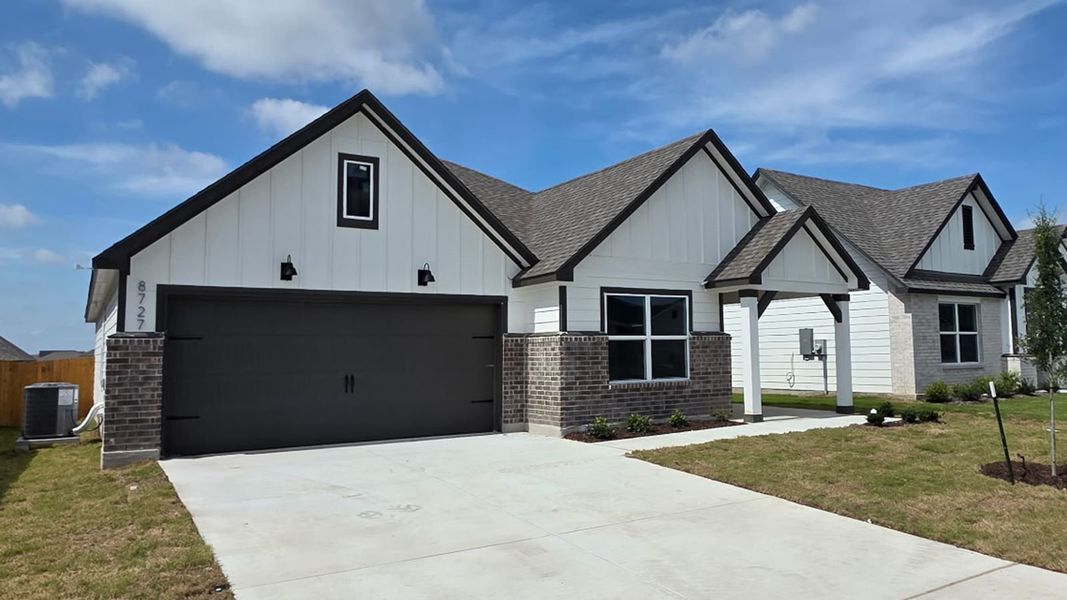 Front exterior of a new home in Mesa Ridge, Temple, TX, highlighting curb appeal (Image 22). Front exterior of a new home in Mesa Ridge, Temple, TX, highlighting curb appeal (Image 22).